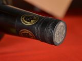 a close up of a bottle of wine on a table