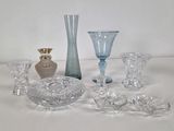 a lot of glass items that are sitting on a table
