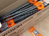 a box full of drill bits sitting on the floor