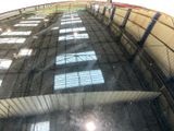 a reflection of a building on the glass of a car