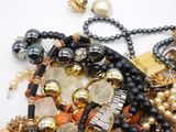 a close up of a bunch of jewelry on a table