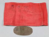 a close up of a coin and a red cloth on a table