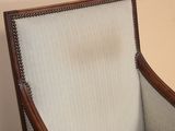 an image of a chair with a white and brown upholstered back
