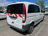 a white van that is parked in a parking lot