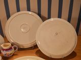a table with plates and cups on it and a cup and saucer