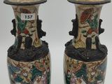 two vases that are sitting on a table