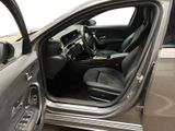 a car with the door open and the driver ' s seat down