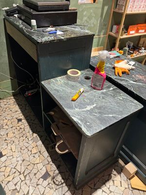 a picture of a work area with a desk and a printer