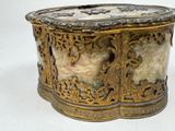 a gold and white box on a white background