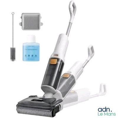 a vacuum that is sitting next to a cleaning brush