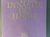 purple book with gold lettering on it sitting on a table