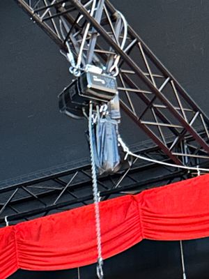 a man that is standing on a stage with a microphone