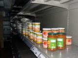 many jars of food on the shelves in the store