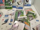 a lot of cell phones that are sitting on a table