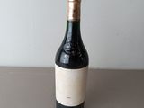 a bottle of wine that is sitting on a table