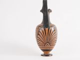 a vase that is sitting on a white surface