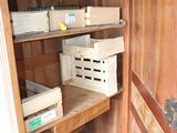 a wooden cabinet with boxes on it in a room