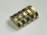 an image of a brass ring on a white surface