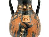 a black and orange vase on a stand with a white background