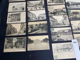 a lot of old black and white photos on the table
