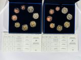 two boxes of coins are sitting on a table with a receipt
