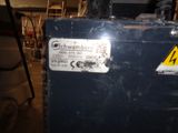 a picture of a blue box with a warning sticker on it