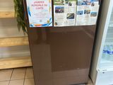 a small refrigerator with a lot of information on it
