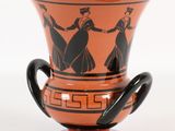 un vase orné d'un motif noir et orange