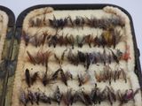 many different types of flies on a tray