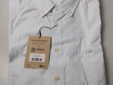 a close up of a shirt with a tag on it