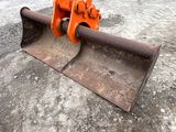 an orange bulldozer that is sitting on the ground