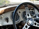 a steering wheel and dashboard of an old car