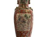 a large vase with a painting on it sitting on a white surface