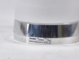 a close up of a silver object on a white surface