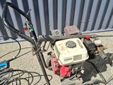 a small lawn mower that is sitting on the ground