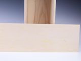 a wooden box that has a piece of wood in it
