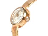 a close up of a wrist watch with a diamond on it
