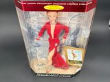 the barbie doll is in a plastic box on a table