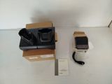 two cell phones that are sitting on a box