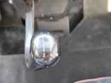 a close up of a car ' s center console with a mirror