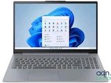 a close up of a laptop on a white surface with a blue background
