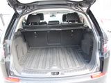 the back of a car with its trunk open and the back seats folded down