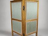 an image of a wooden screen with striped fabric on it