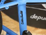 a close up of a bicycle with a blue frame