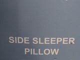 a sign that says side sleeper pillow on the side of a building