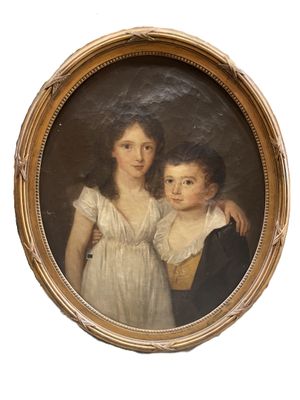 portrait d'un jeune garçon et d'une jeune fille dans un cadre doré
