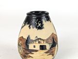 a black and white vase with a painting on it