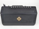 a close up of a black box with a bunch of screws in it
