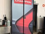 a picture of a refrigerator in a garage with a sign that says champion