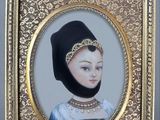 a picture of a picture of a woman wearing a black headdress